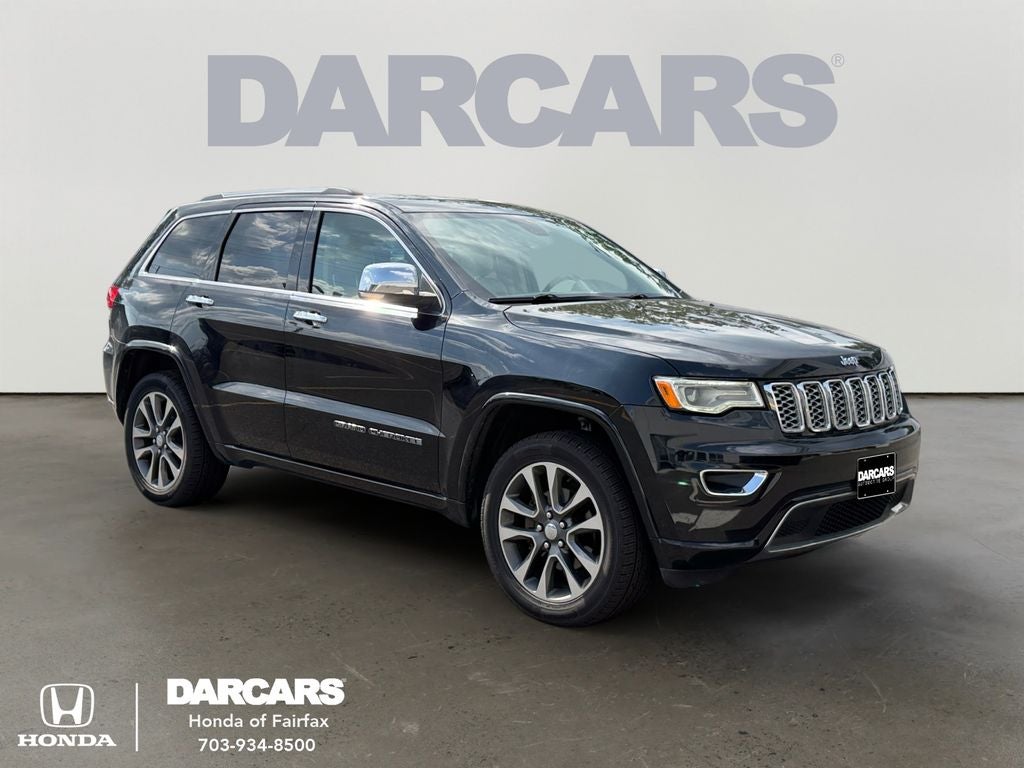 2017 Jeep Grand Cherokee Overland in Diamond Black Crystal Pearlcoat — front three-quarter view