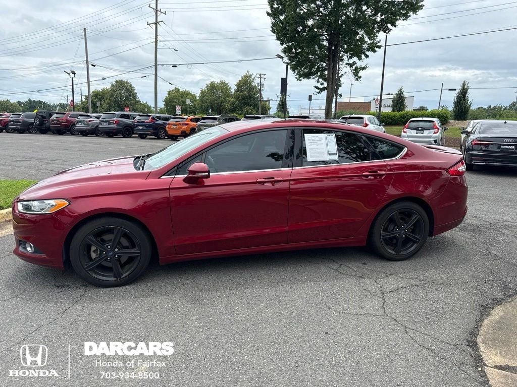 2016 Ford Fusion SE in Ruby Red Metallic — front three-quarter view