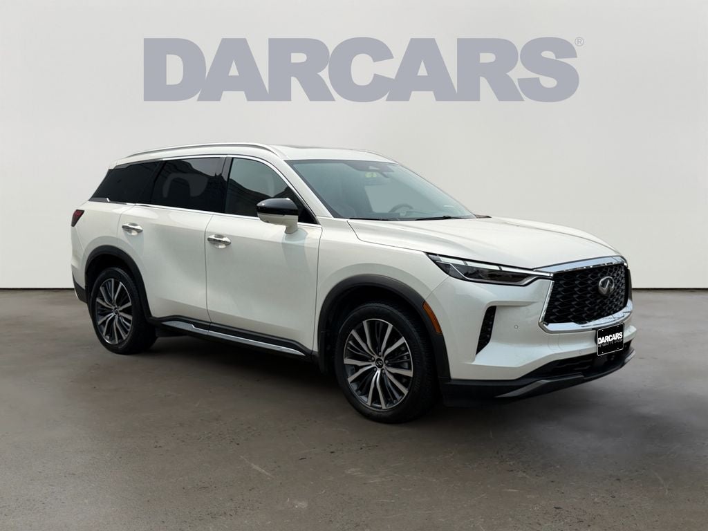 2023 INFINITI QX60 Sensory in Majestic White — front three-quarter view